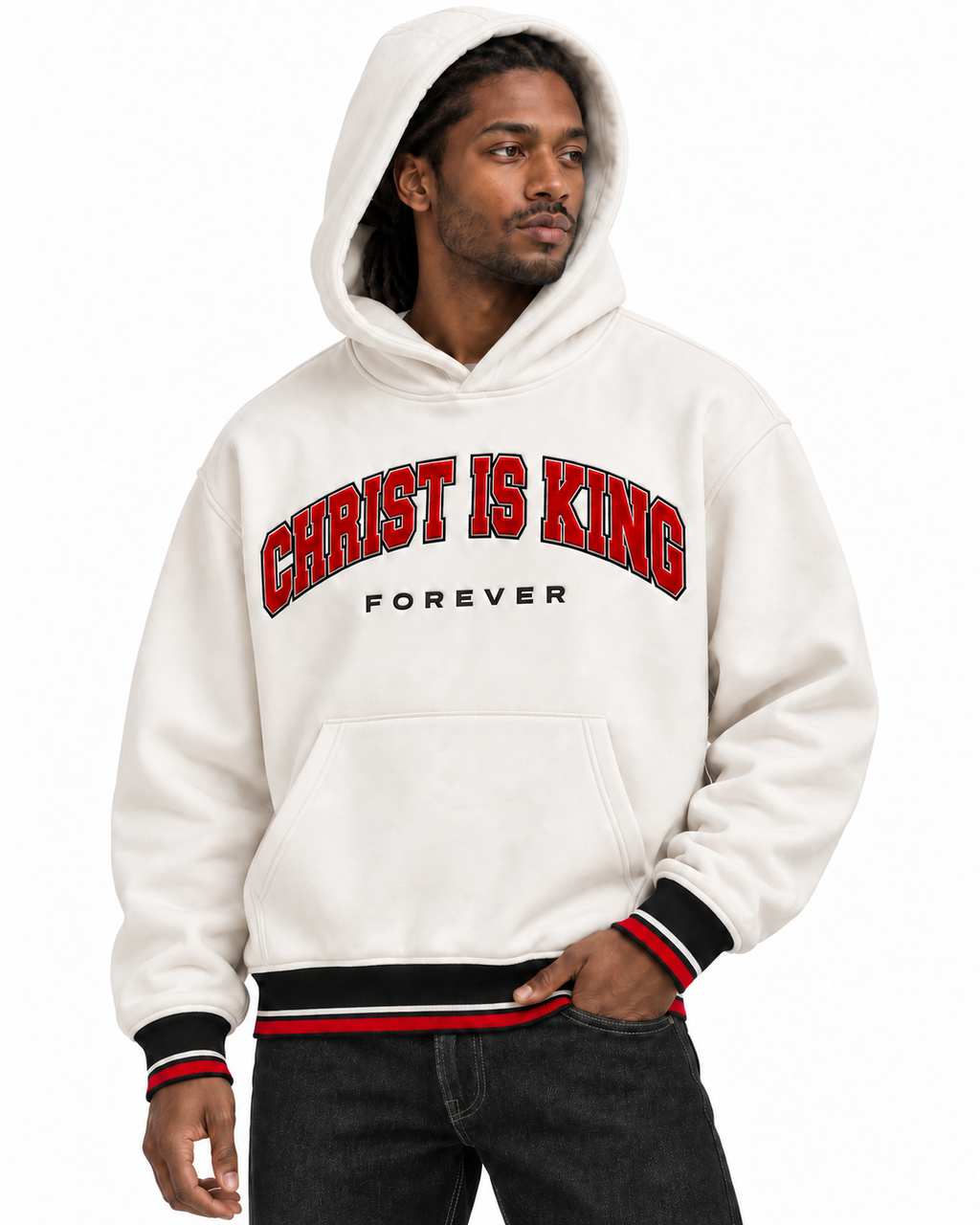 Hood-up portrait showing the red CHRIST IS KING lettering, black FOREVER detail, and striped cuffs on the white Chief Of Sinners Varsity Hoodie.