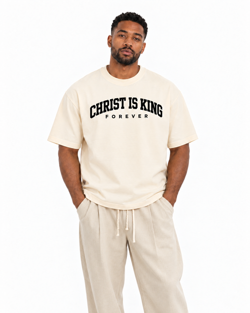 Chief Of Sinners Christ Is King Drop Shoulder Tee Cream — Milk Apricot tee, male close-up